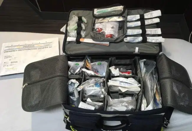 A pile of luggage sitting on top of a suitcase
Description automatically generated